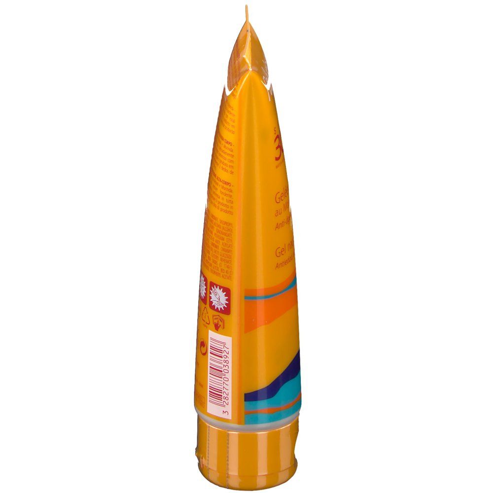 Gelbe Tube, Seitenansicht. Aufschrift und Designelemente. Unten: Schraubverschluss. Oben: Spitze.