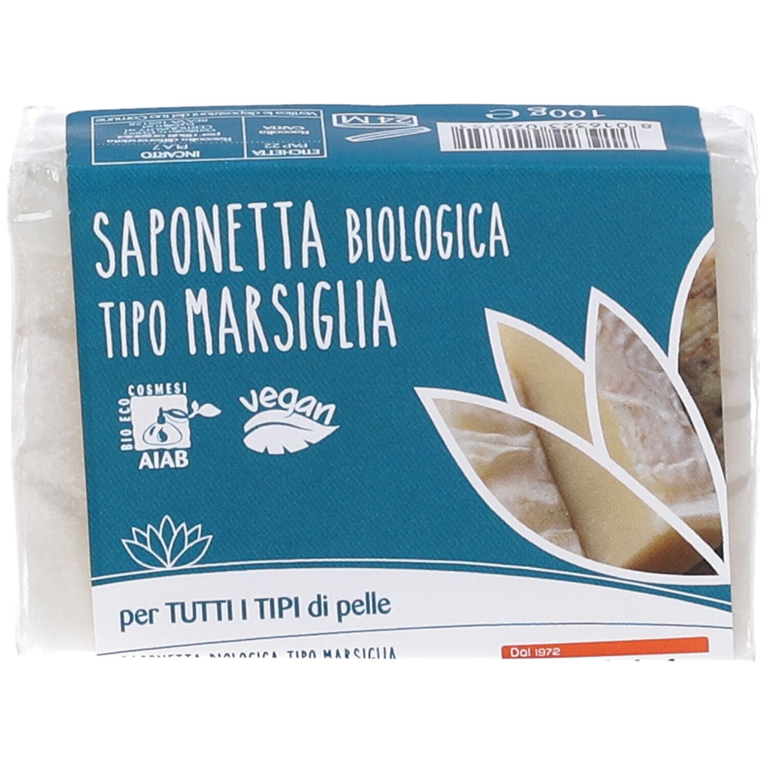 Savon emballé. Emballage bleu avec texte: Saponetta Biologica Tipo Marsiglia, logo vegan, certification AIAB, texte: per tutti i tipi di pelle.