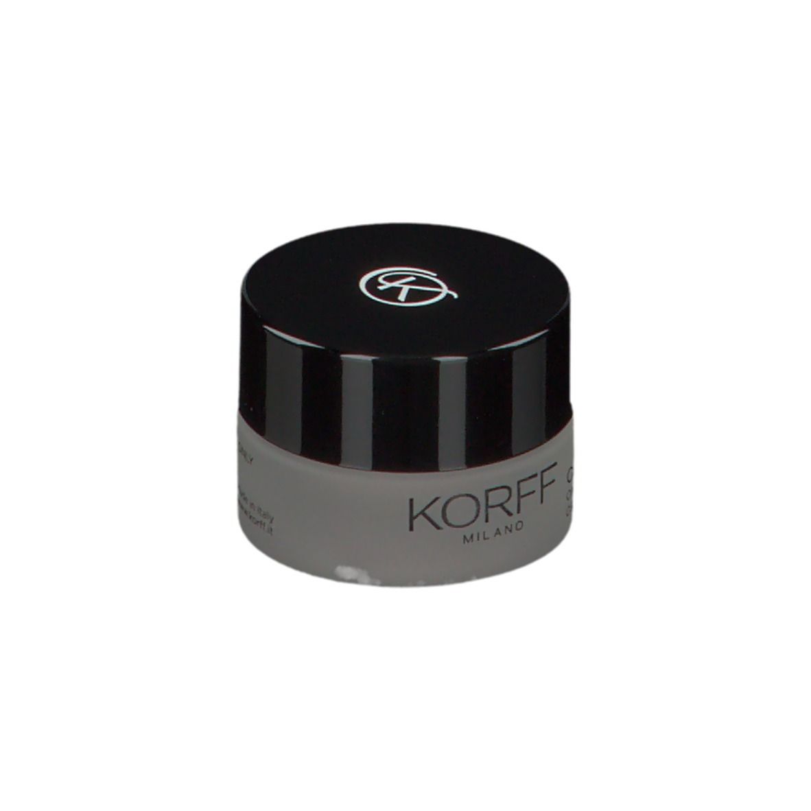 KORFF Creme-Lidschatten, geschlossen. Graues Glas, schwarzer Deckel mit Logo. Text: KORFF MILANO, CURE MAKE UP, CREMA EYESHADOW.