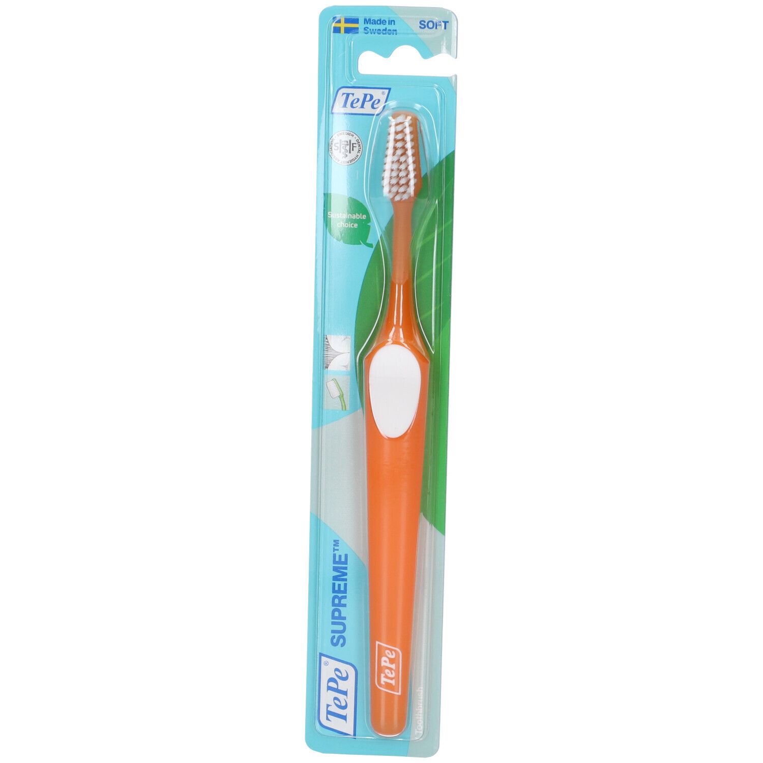 Brosse à dents TePe Supreme™ emballée. Manche orange, insert blanc. Soies souples. Marque TePe.