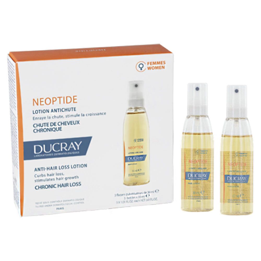 Verpackung mit drei Haartinkturen. Produktname und Marke auf der Verpackung und den Flaschen. Flaschen mit gelblicher Flüssigkeit.