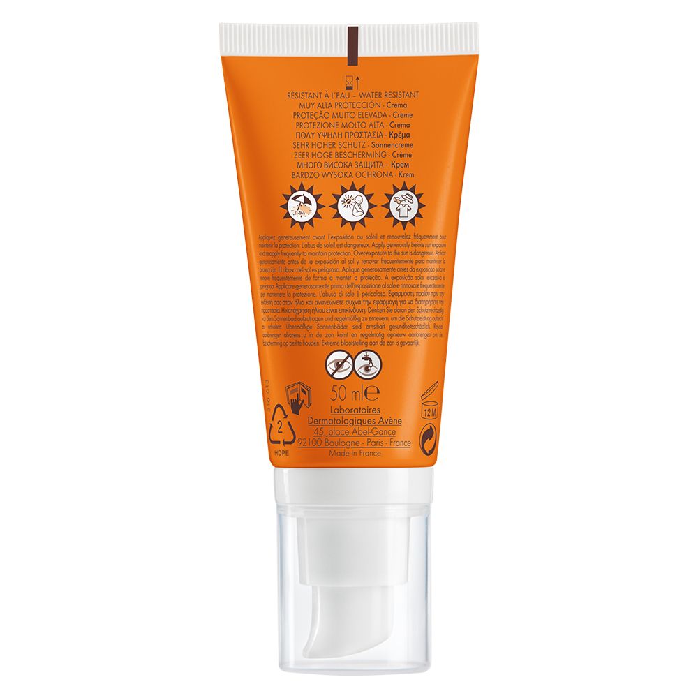 Dos d'un tube orange. Texte et symboles. Résistant à l'eau. Pour peaux sèches et sensibles.