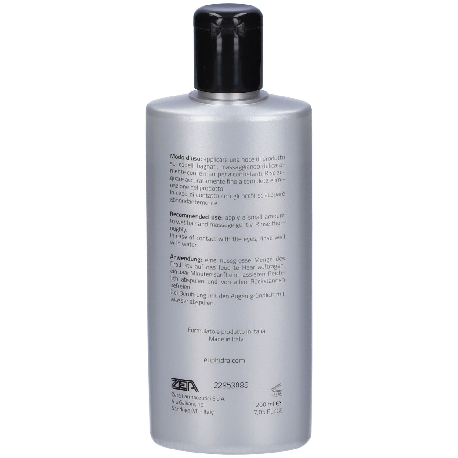 Dos du flacon de shampooing. Texte multilingue. Informations sur l'utilisation et les ingrédients.