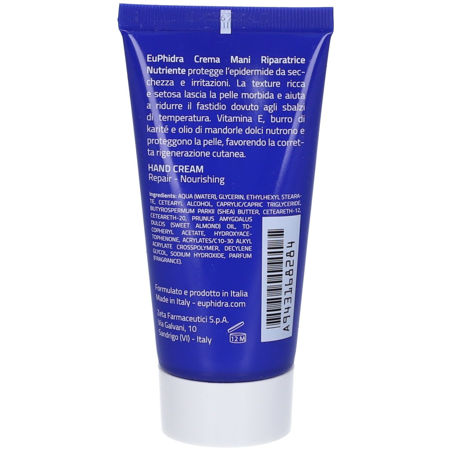 Dos du tube bleu. Texte: ingrédients, informations fabricant. Code-barres et numéro de lot. Symbole 12M.