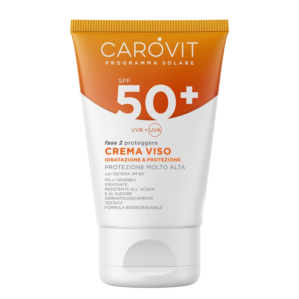 Gesichtscreme-Tube mit SPF 50+ von Carovit. Orange-weißes Design. Text: Creme Viso, Schutz.