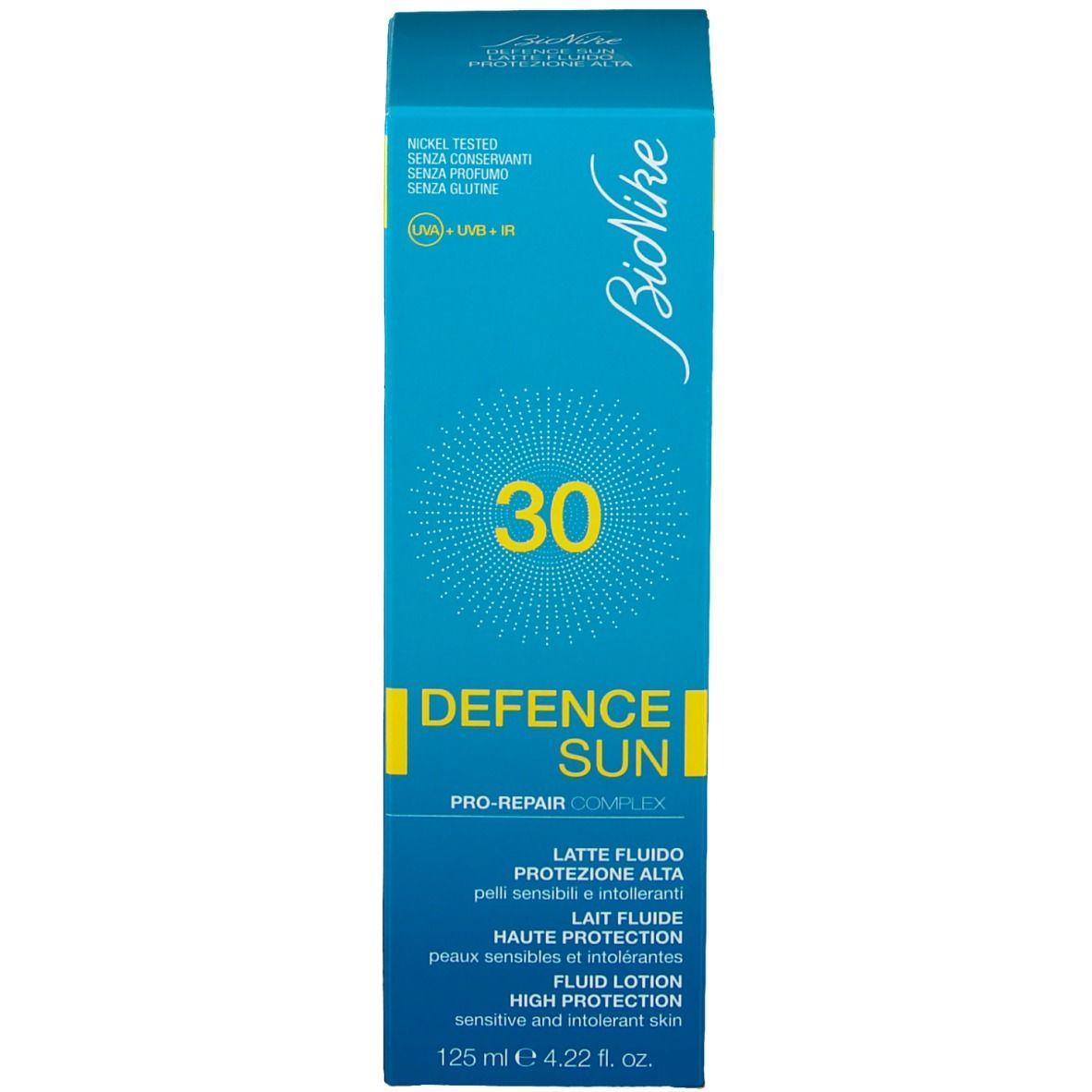 Türkisblaue Schachtel. Aufschrift: 30, Defence Sun, Pro-Repair Complex, Lait Fluide, High Protection. 125 ml.