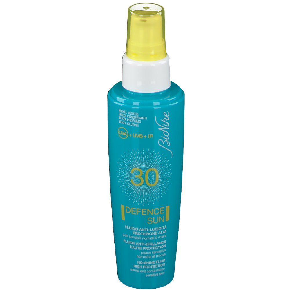 Türkisgrüne Flasche mit gelbem Sprühkopf. Aufschrift: 30, Defence Sun, Bionike. Für empfindliche Haut.