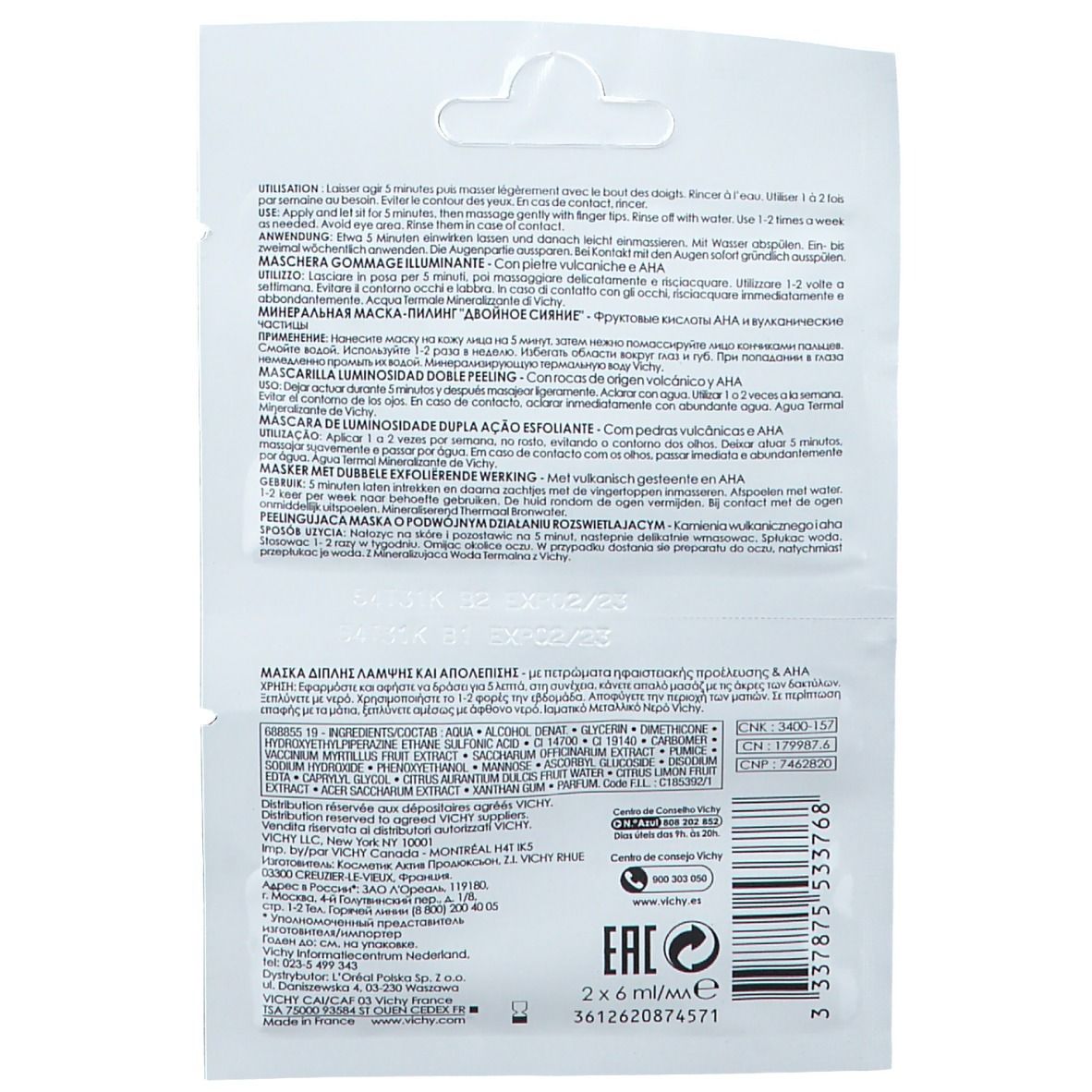 Rückseite der Vichy Peelingmaske. Textinformationen in mehreren Sprachen. Produktname nicht sichtbar. Verpackung mit Öffnung.