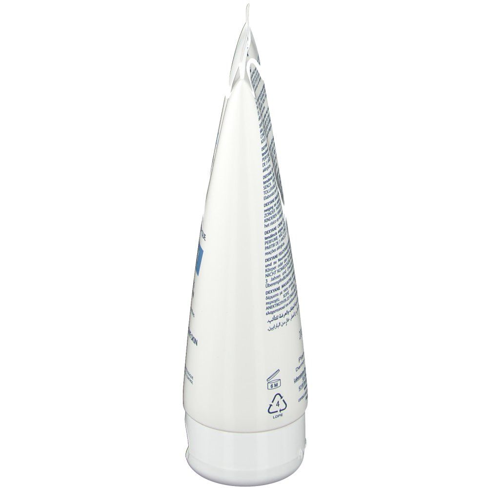 Vue latérale d'un tube blanc. Contient du texte. Impressions et symboles. Le bouchon et le tube sont blancs.