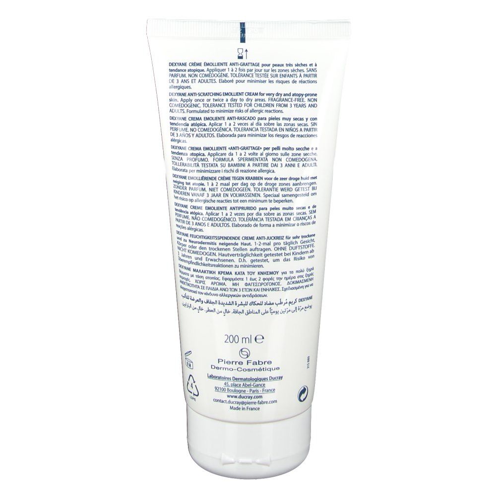 Dos d'un tube blanc. Contient du texte en plusieurs langues. Marque Ducray. Volume: 200 ml. Avec symboles.