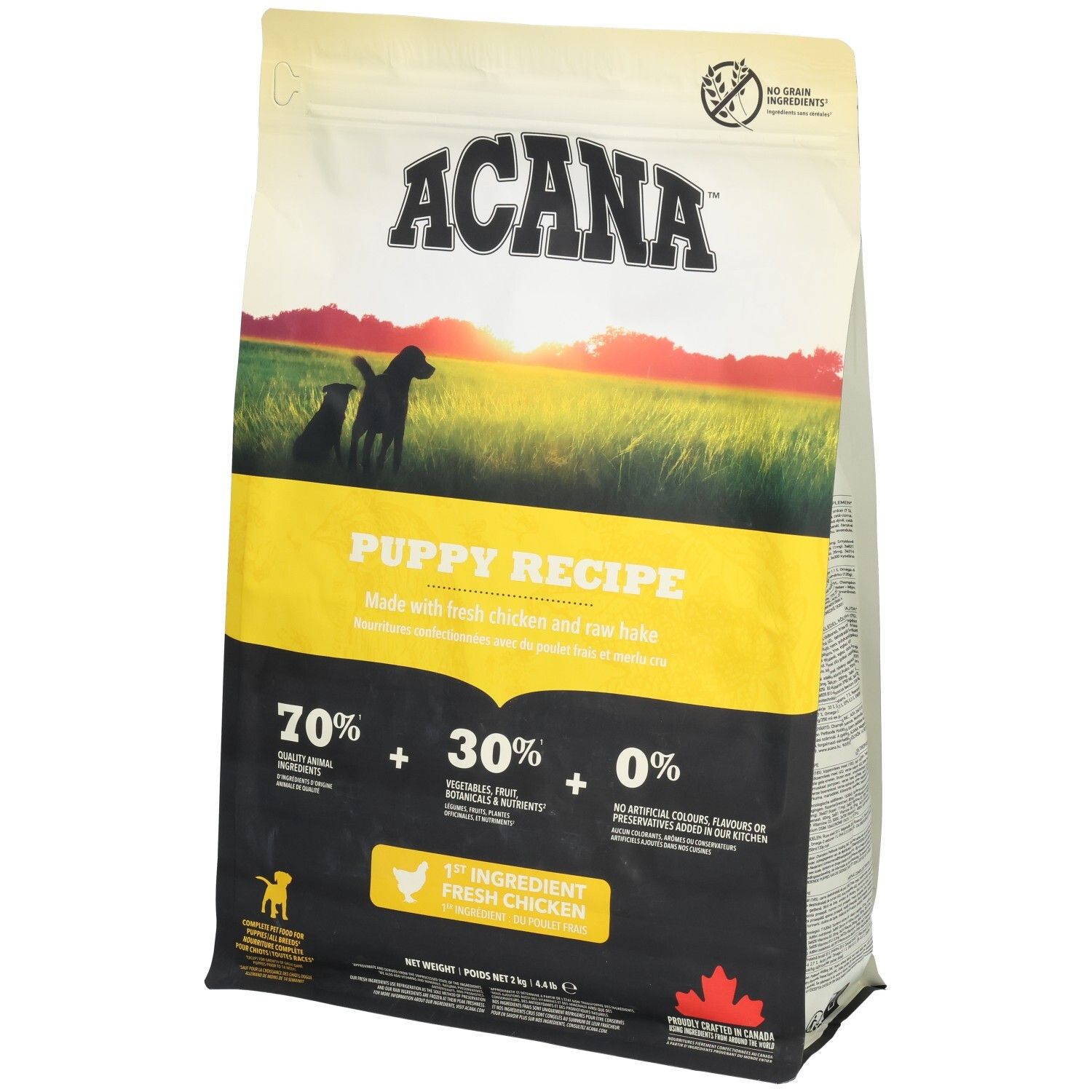 Beutel ACANA Puppy Recipe. Gelb-schwarzes Design mit Welpen-Silhouette. Enthält 70% tierische Zutaten, 30% Gemüse, Obst, 0% künstliche Zusätze.