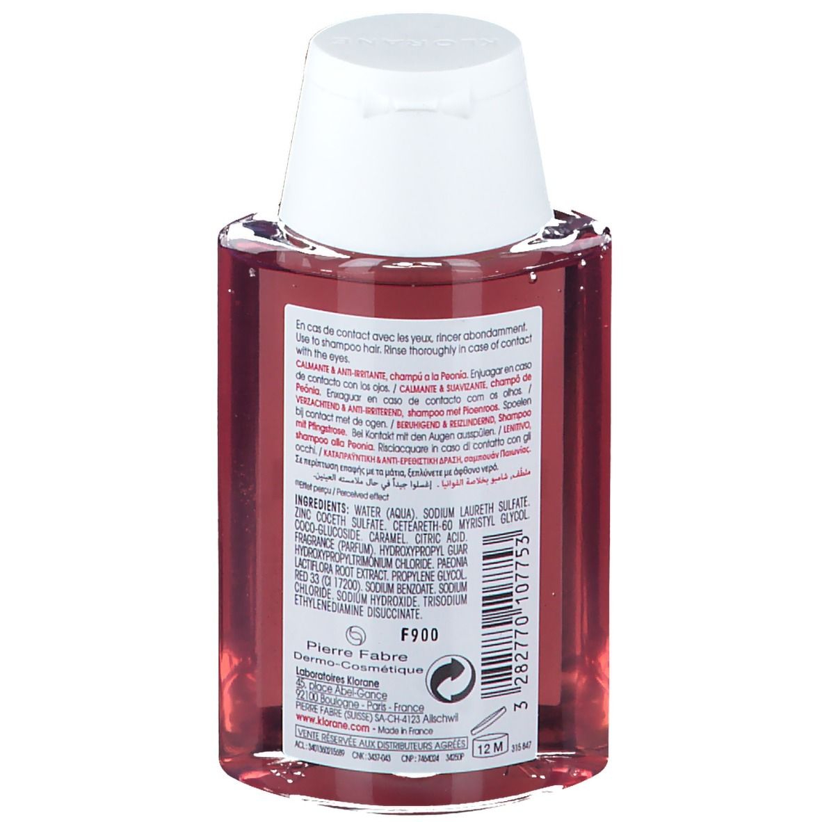 Rückseite der KLORANE Shampoo-Flasche. Enthält Inhaltsstoffe, Warnhinweise und Herstellerinformationen. Weißer Deckel.