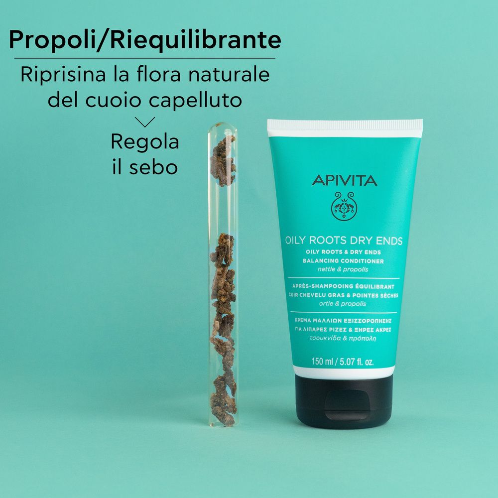 Tube und Zutaten. Aufschrift: APIVITA, OILY ROOTS DRY ENDS, Balancing Conditioner. Text: Propoli/Riequilibrante, Regola il sebo.