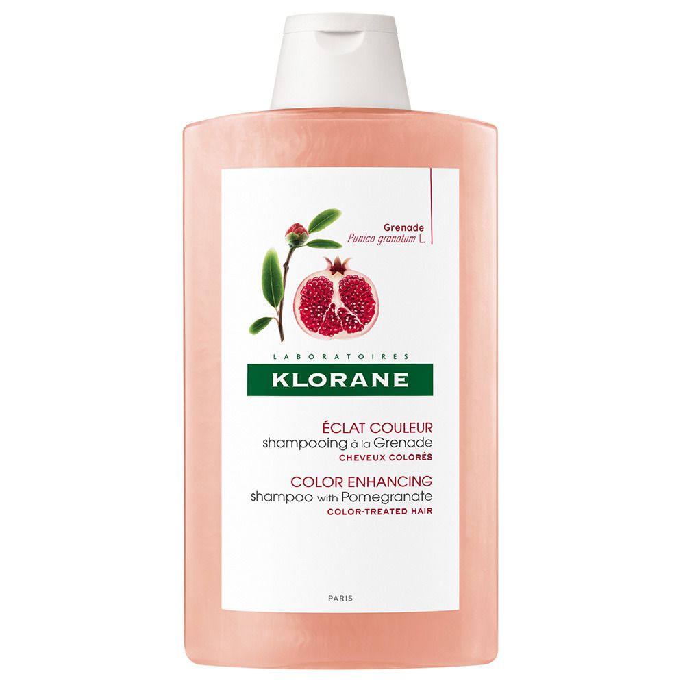 Flasche mit rosa Shampoo. Weißer Deckel. Etikett mit Granatapfel-Illustration und Text: KLORANE, ÉCLAT COULEUR, COLOR ENHANCING.