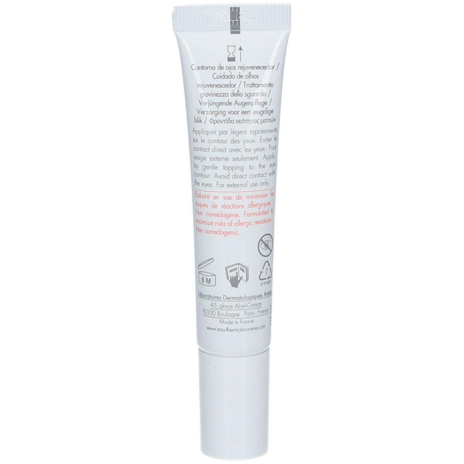 Dos d'un tube blanc. Texte en plusieurs langues. Symboles et logos.