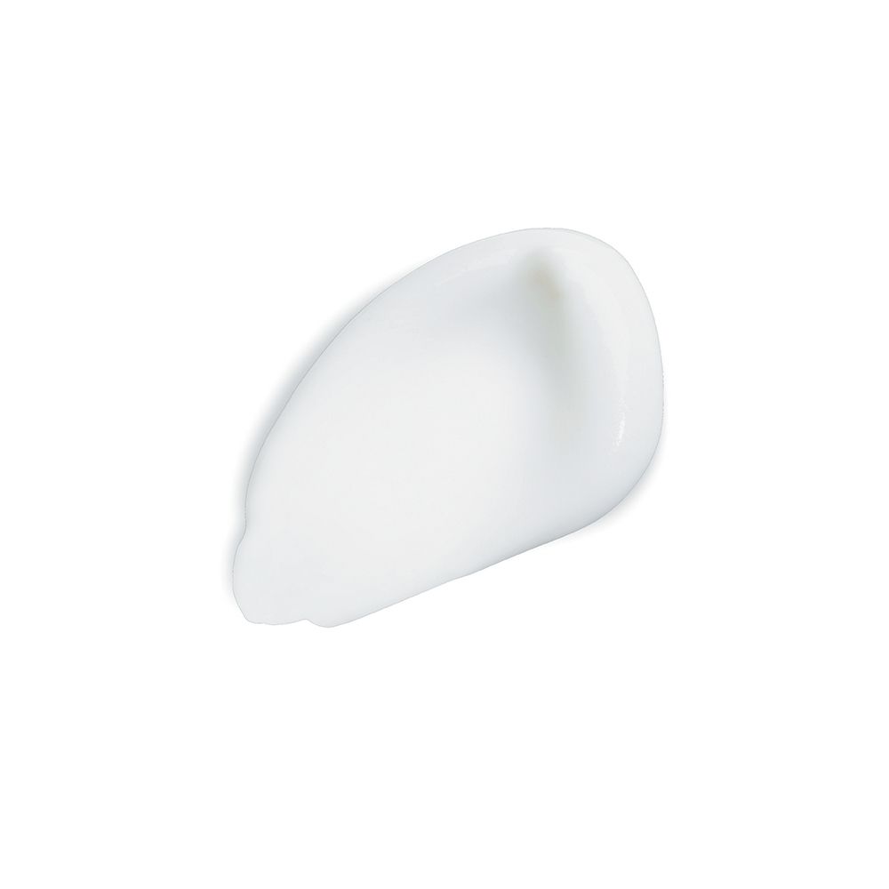 Goutte de crème blanche sur fond blanc.