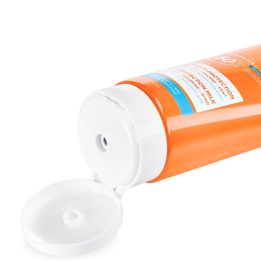 Gros plan du bouchon blanc ouvert d'un tube orange. Ouverture visible pour l'extraction du produit.