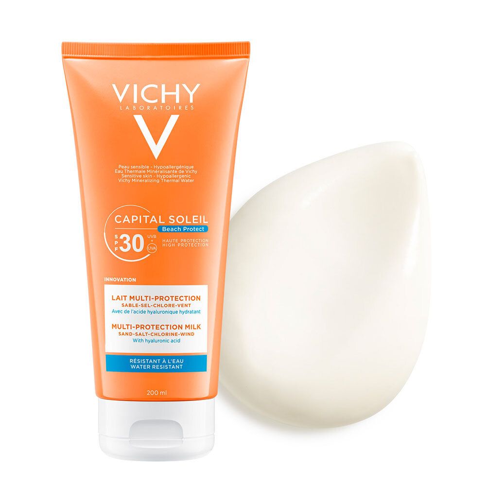 Tube orange avec bouchon blanc et substance crémeuse à côté. Inscriptions: VICHY, CAPITAL SOLEIL, SPF 30, Lait Multi-Protection.