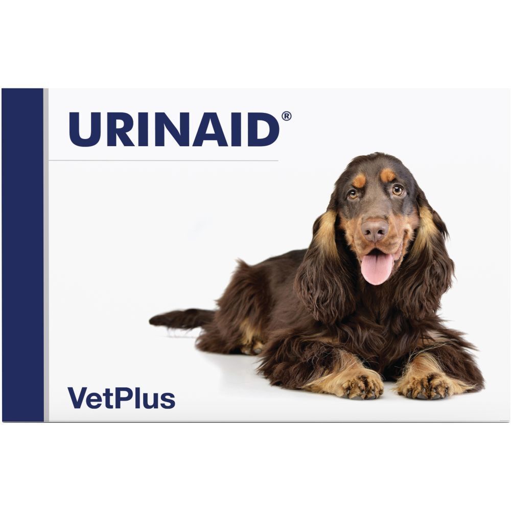 Emballage du produit avec le texte URINAID et un chien. Le nom de la marque VetPlus est également visible.