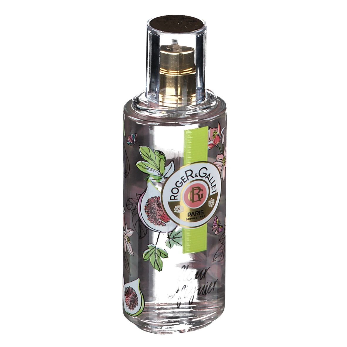 Flacon transparent avec vaporisateur doré. Étiquette avec figues, fleurs et logo. Bande verte et blanche avec logo.