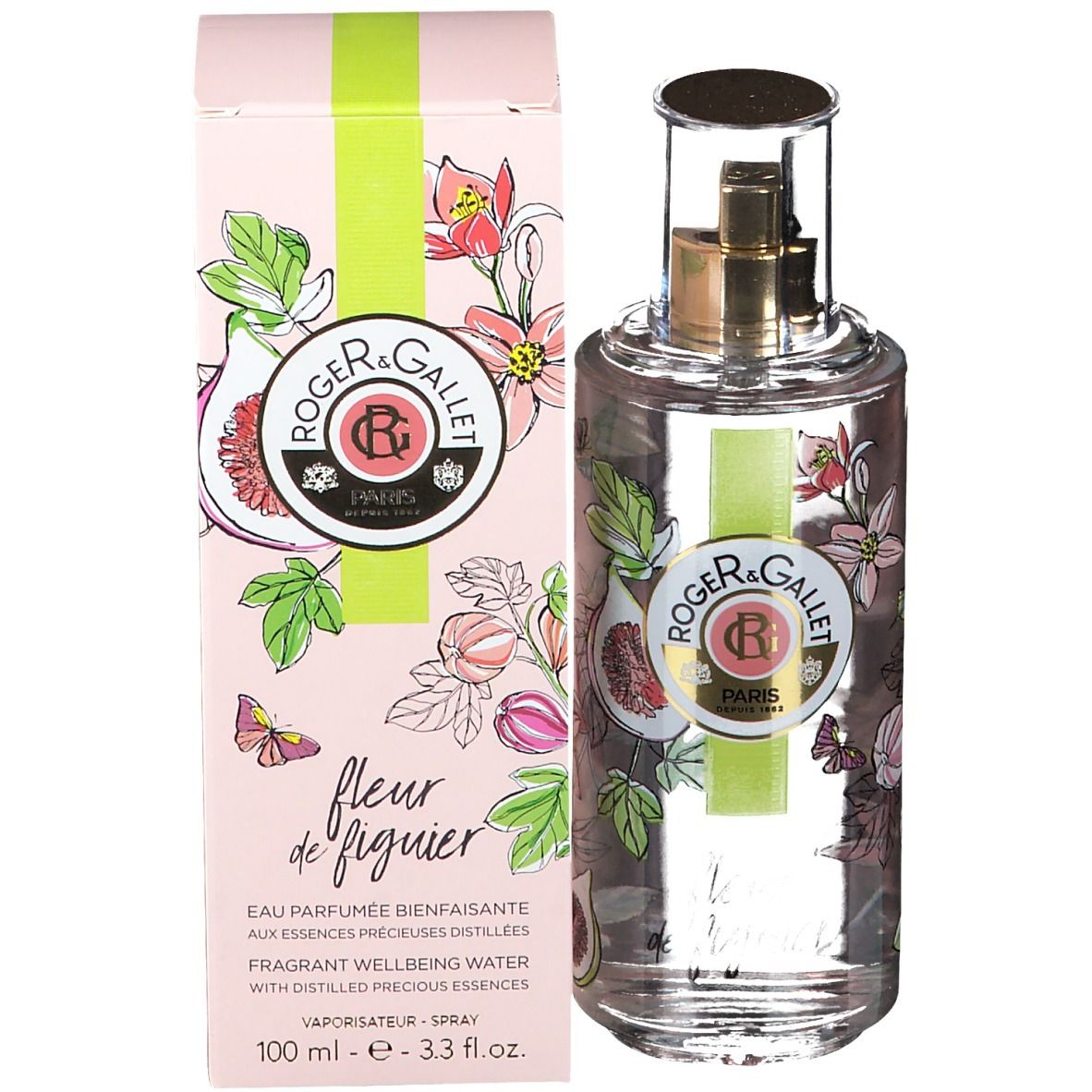 Produit avec emballage. Boîte rose avec logo, décor de figues et fleurs. Bande verte. Flacon à côté.