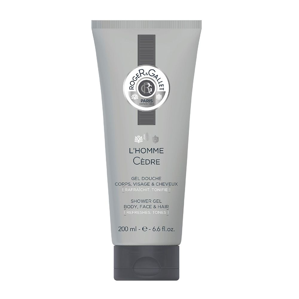 Tube gris avec logo et nom du produit. Texte: Gel Douche, L'Homme Cèdre. Bouchon noir.