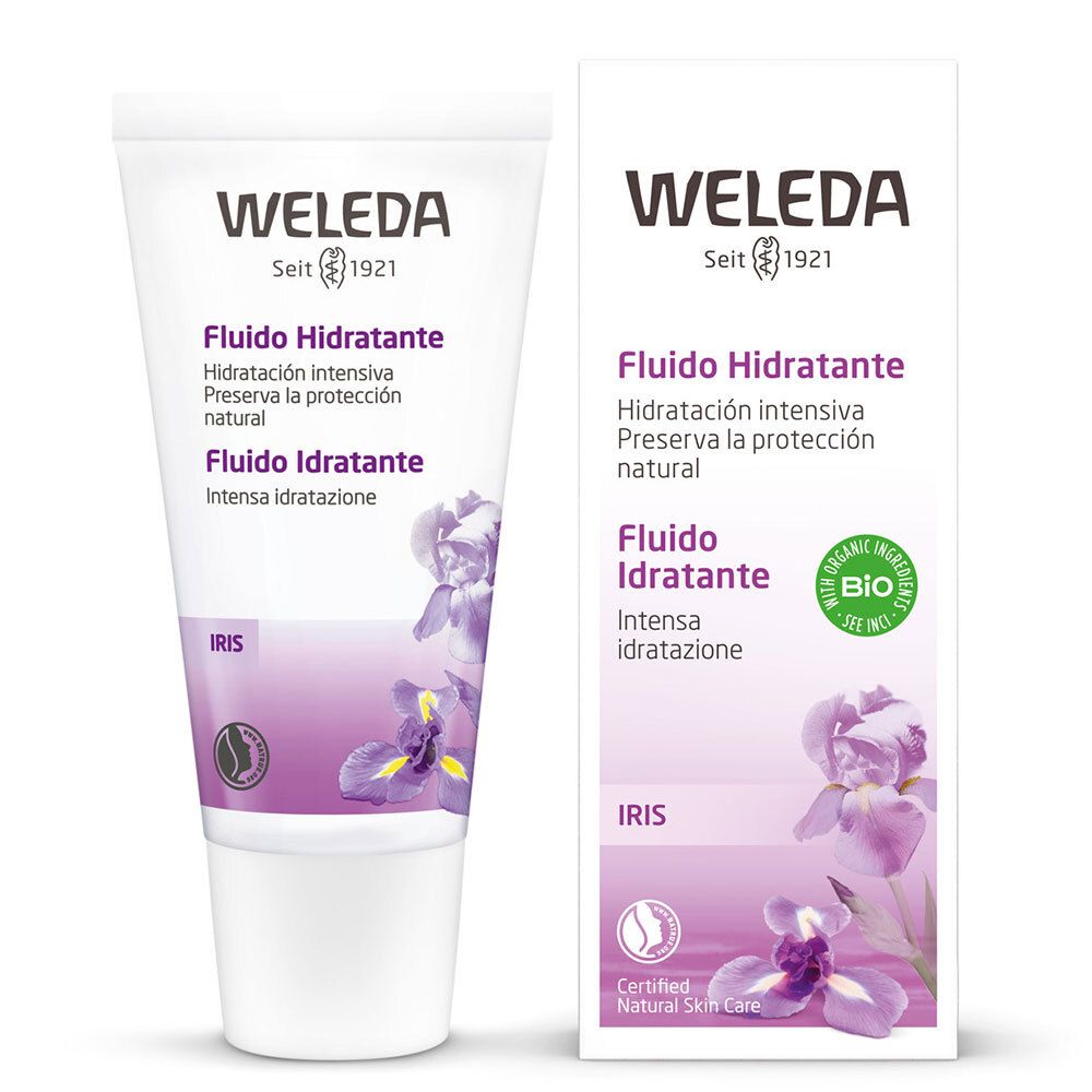 Weleda-Gesichtsfluid-Tube und Verpackung. Weiß, mit lila Akzenten und Iris-Blüten. Text: „Fludio Idratante“ und „Bio“ Siegel.