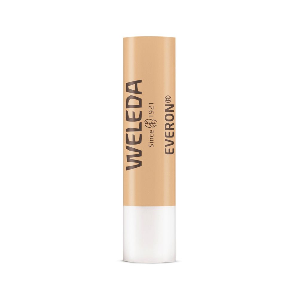Bâton de soin pour les lèvres Everon®. Bâton beige avec extrémité blanche. Logo et texte Weleda.