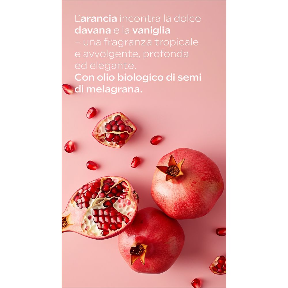 Rosa Hintergrund mit Granatäpfeln. Aufgeschnittene Frucht mit Kernen. Text über Duft. Mit Bio-Öl aus Granatapfelkernen.