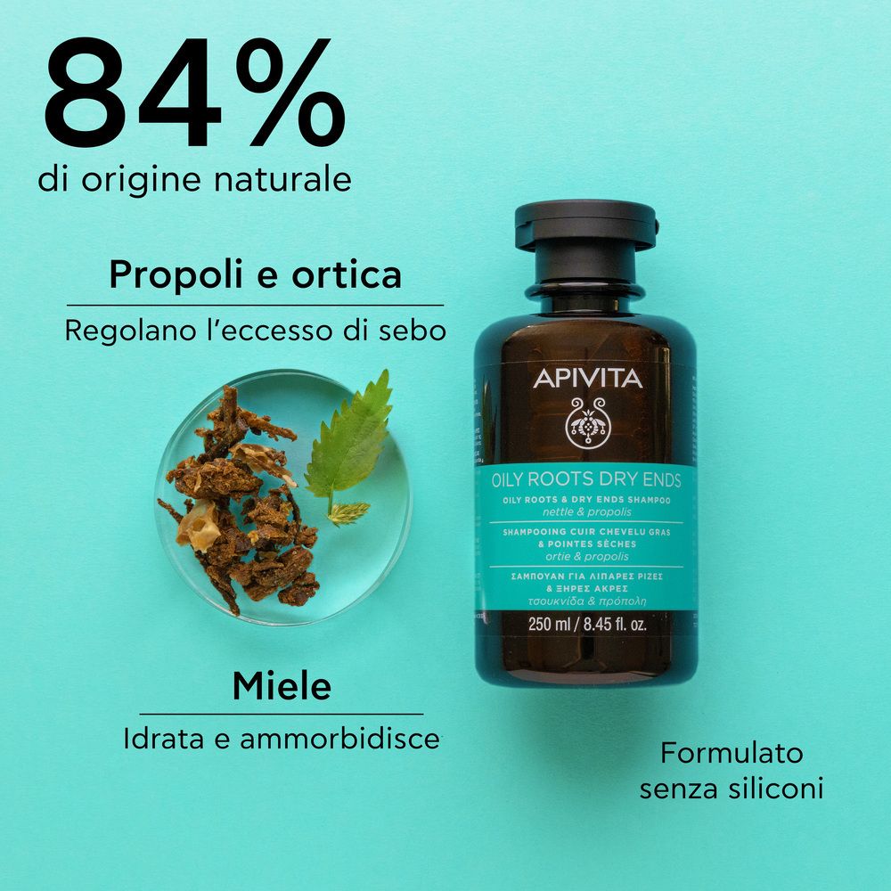 Flacon de shampooing à côté d'herbes. Texte : 84% d'origine naturelle. Propolis et ortie régulent le sébum.