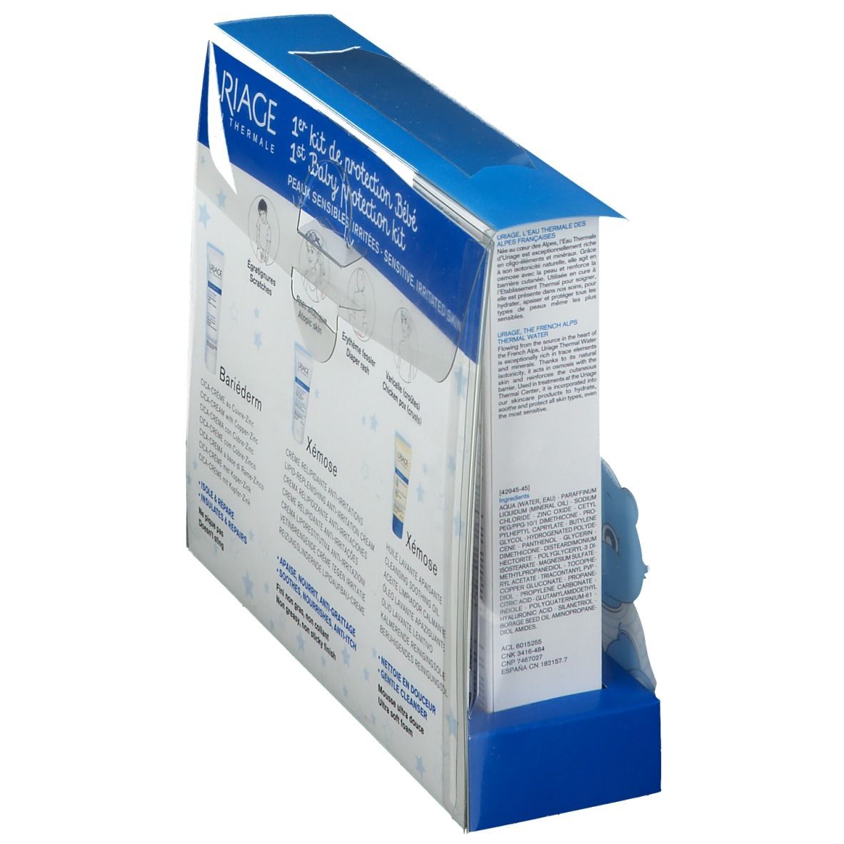 Baby-Schutz-Kit. Rückseite mit Produktinformationen und Illustrationen. Creme und Reinigungsöl. Text auf Französisch.