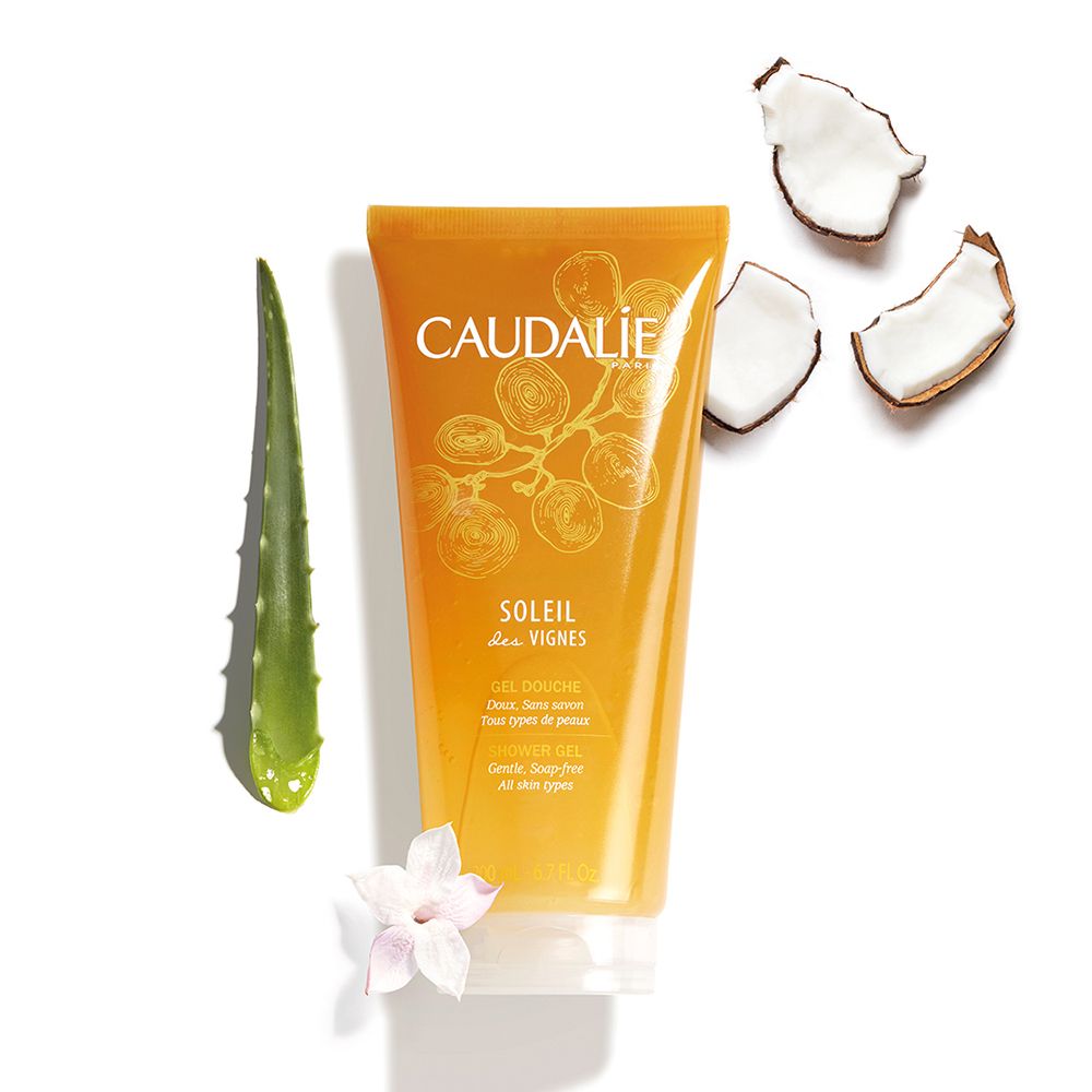 Gel douche avec aloe vera, noix de coco et fleur. Inscription CAUDALÍE, SOLEIL des VIGNES.