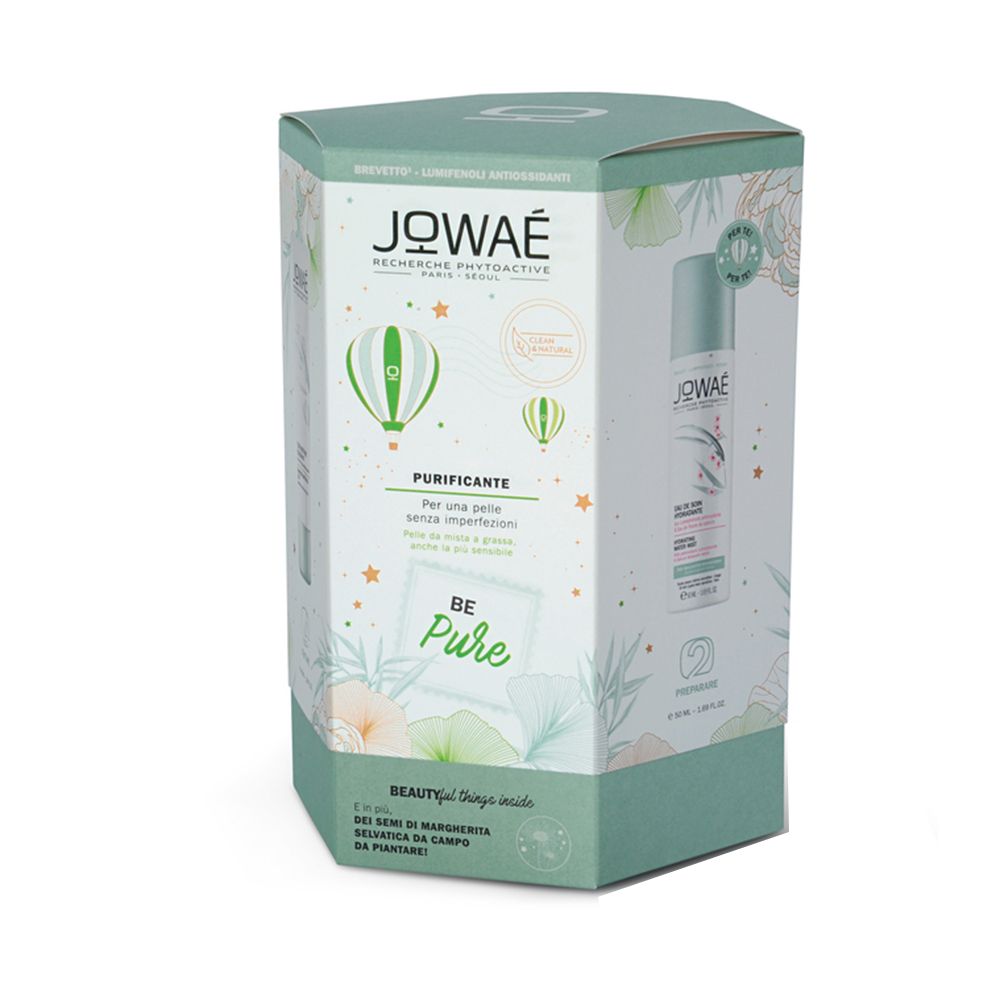 Sechseckige Geschenkbox mit Produktabbildung und Schriftzug JOWAE. Grün-weiße Verpackung mit floralen Elementen und Produktinformationen.