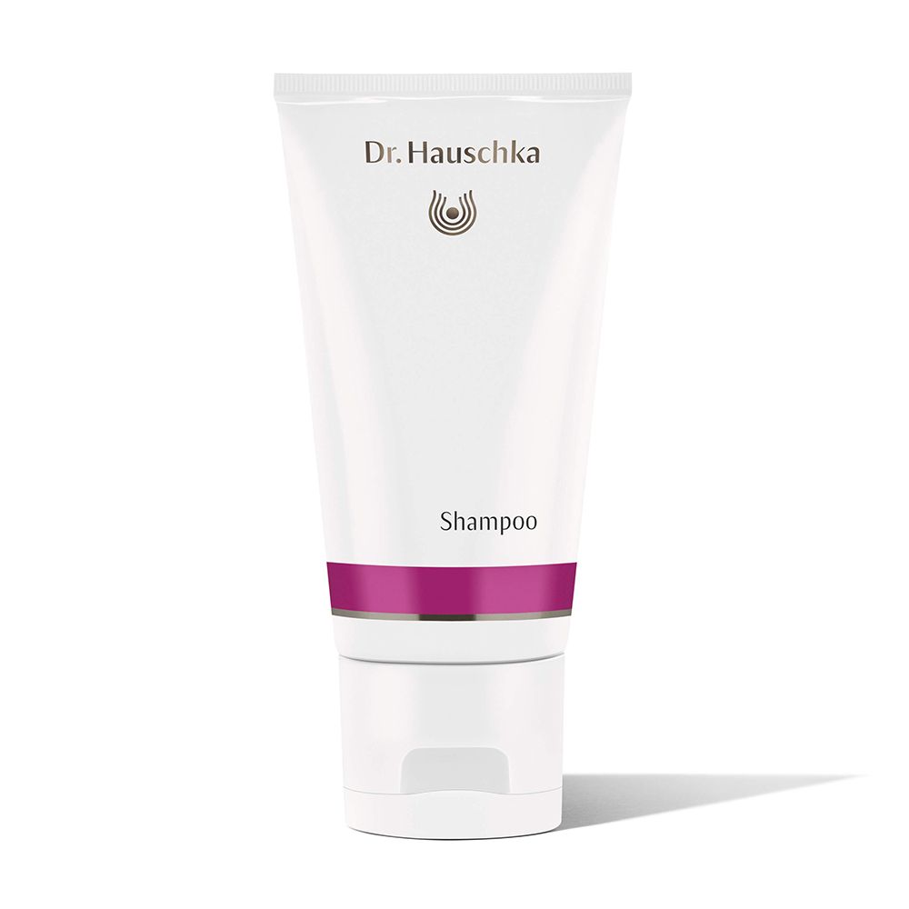 Weiße Tube mit lila Band. Aufschrift: Dr. Hauschka, Shampoo. Verschlusskappe unten.