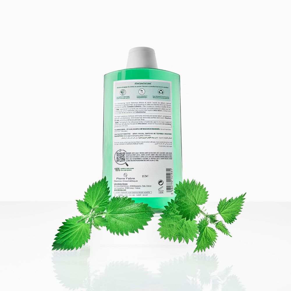 Dos du flacon de shampooing KLORANE. Texte, QR code et certifications. Feuilles d'ortie.