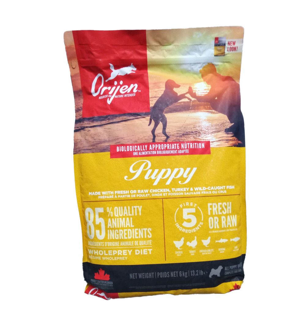 Orijen Puppy Hundefutter, 6 kg Beutel. Roter und gelber Beutel mit Logo, Welpen-Illustration und Text: 85% tierische Inhaltsstoffe.