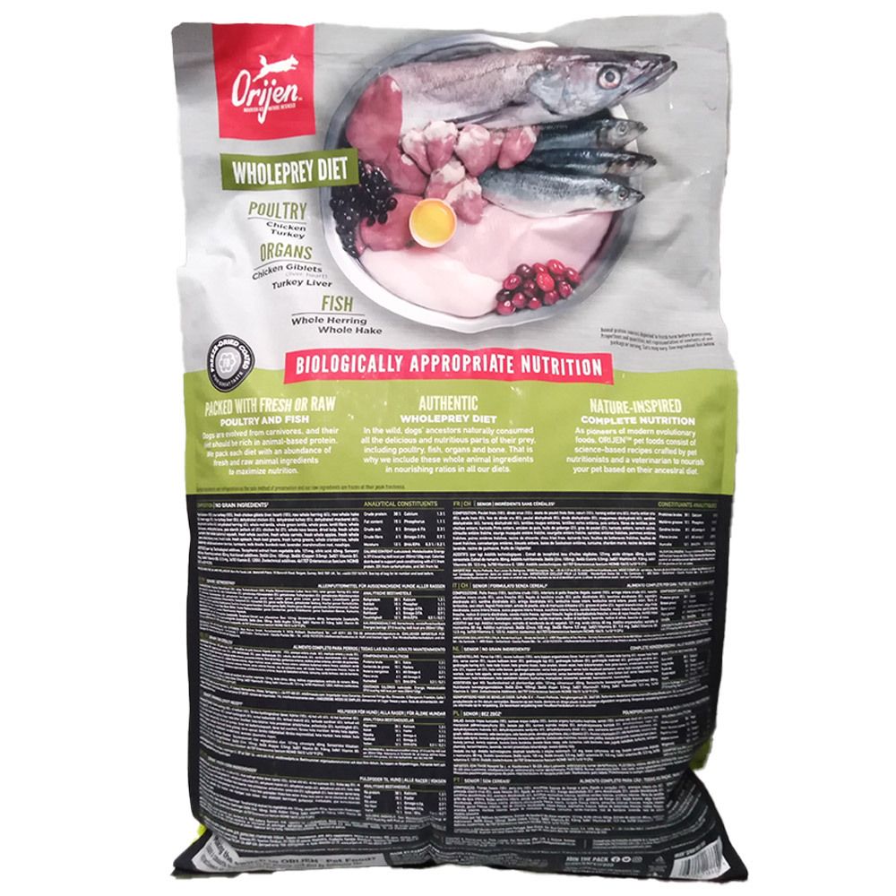 Hinterseite einer Orijen Wholeprey Diet Hundefutterpackung mit Bild von rohen Zutaten wie Fisch und Fleisch.