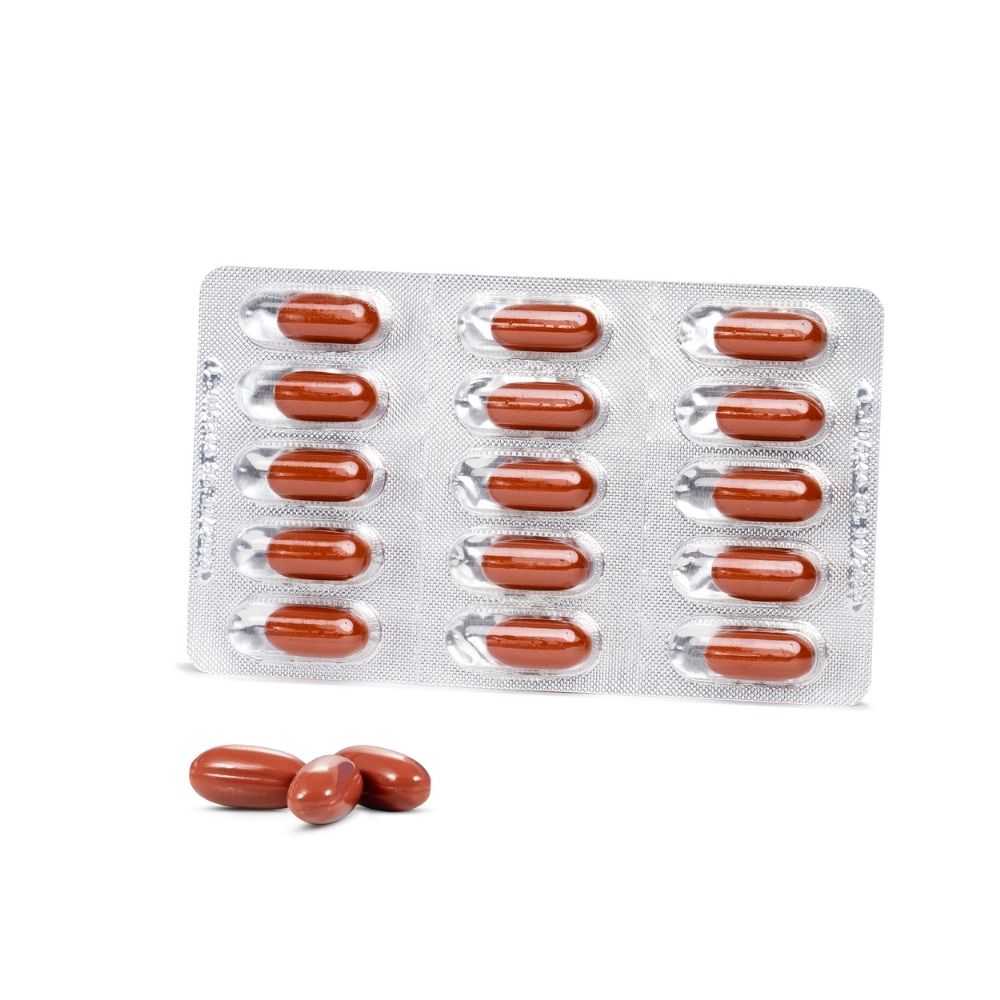 Blisterpackung mit 15 braunen Kapseln und drei einzelnen Kapseln.