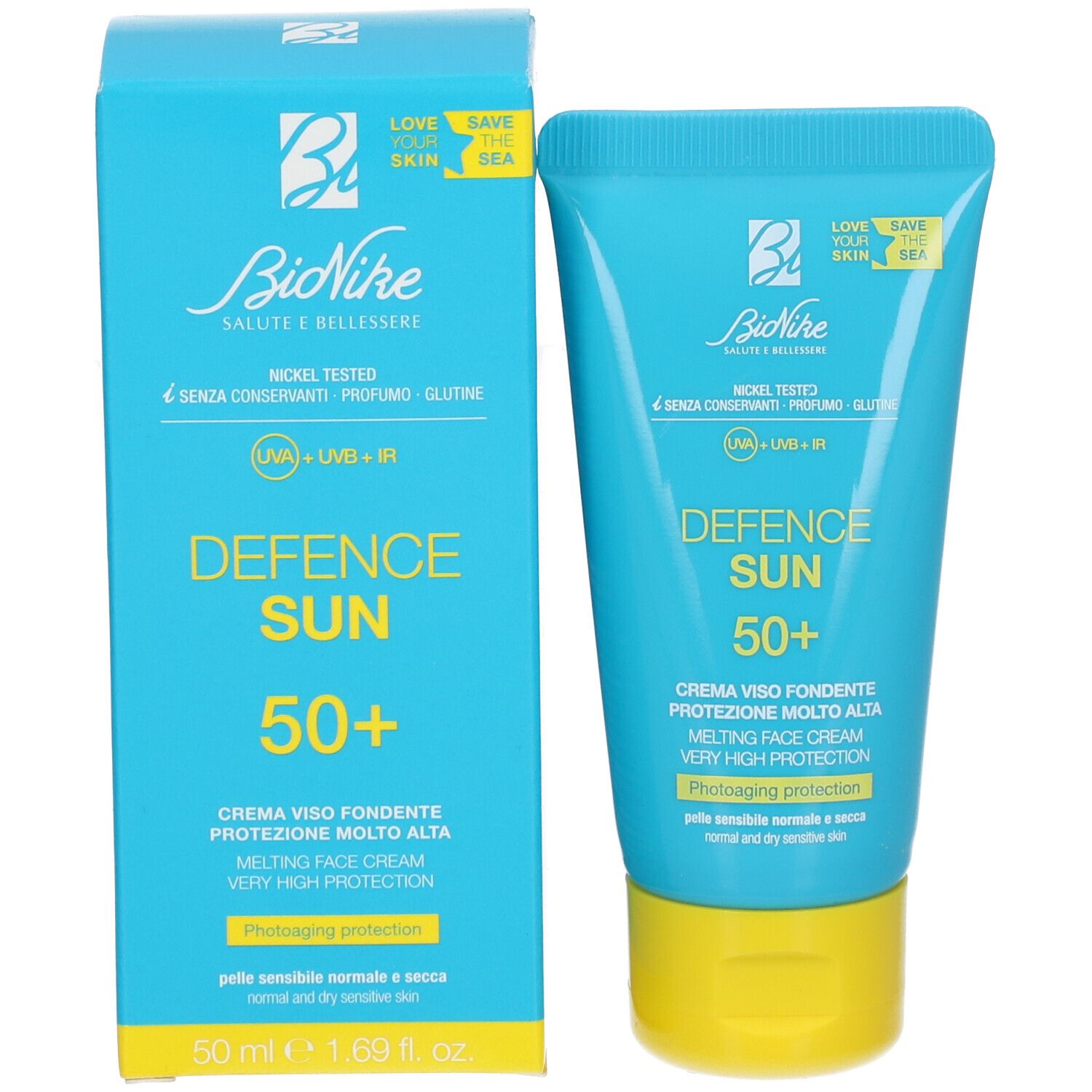Boîte et tube turquoise avec bouchon jaune. Inscription : Defence Sun 50+. Marque BioNike. Texte en italien.