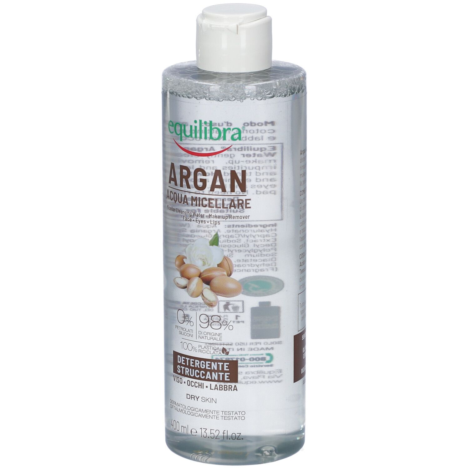 Flacon transparent avec bouchon blanc. Étiquette avec nom du produit, illustration d'argan et texte. Pour peau sèche.