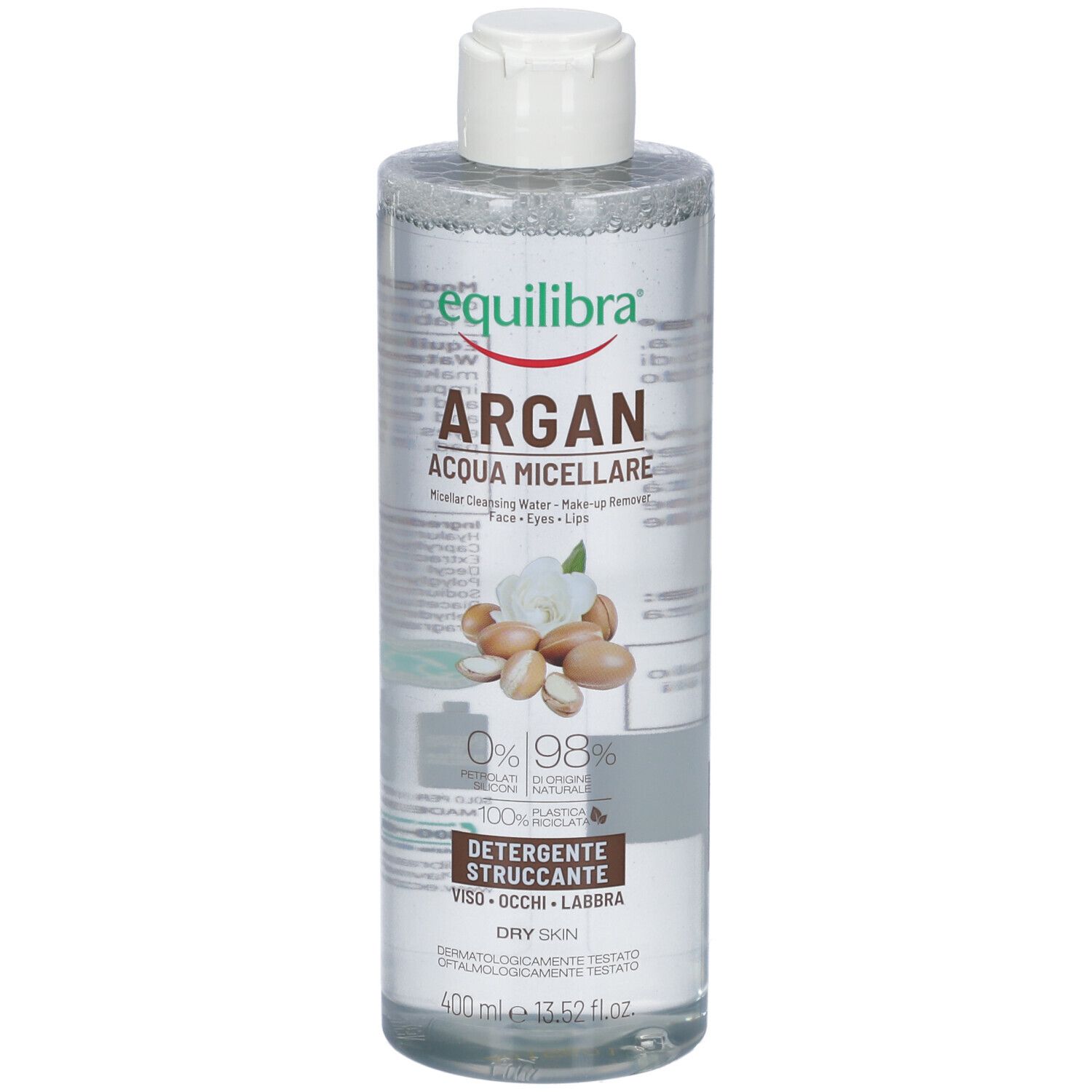 Flacon transparent avec bouchon blanc. Étiquette avec nom du produit, illustration d'argan et texte. Pour peau sèche.
