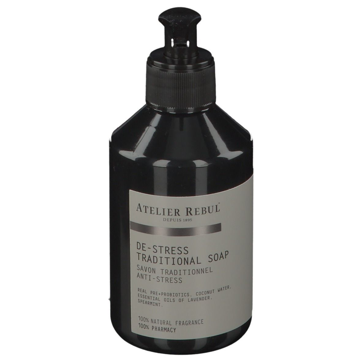 Flacon noir avec pompe. Inscription : ATELIER REBUL, DE-STRESS TRADITIONAL SOAP. Contient des huiles essentielles.