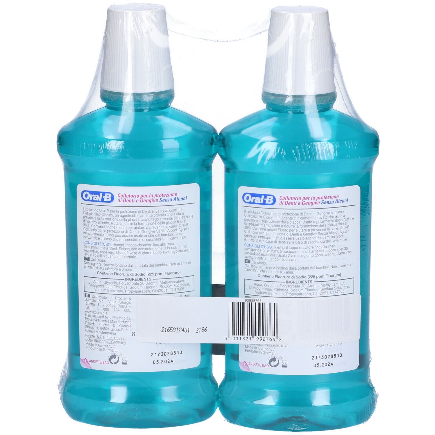 Deux flacons de bain de bouche emballés dans du film plastique. Vue arrière. Liquide turquoise, bouchon blanc, étiquette bleue. Inscription italienne.