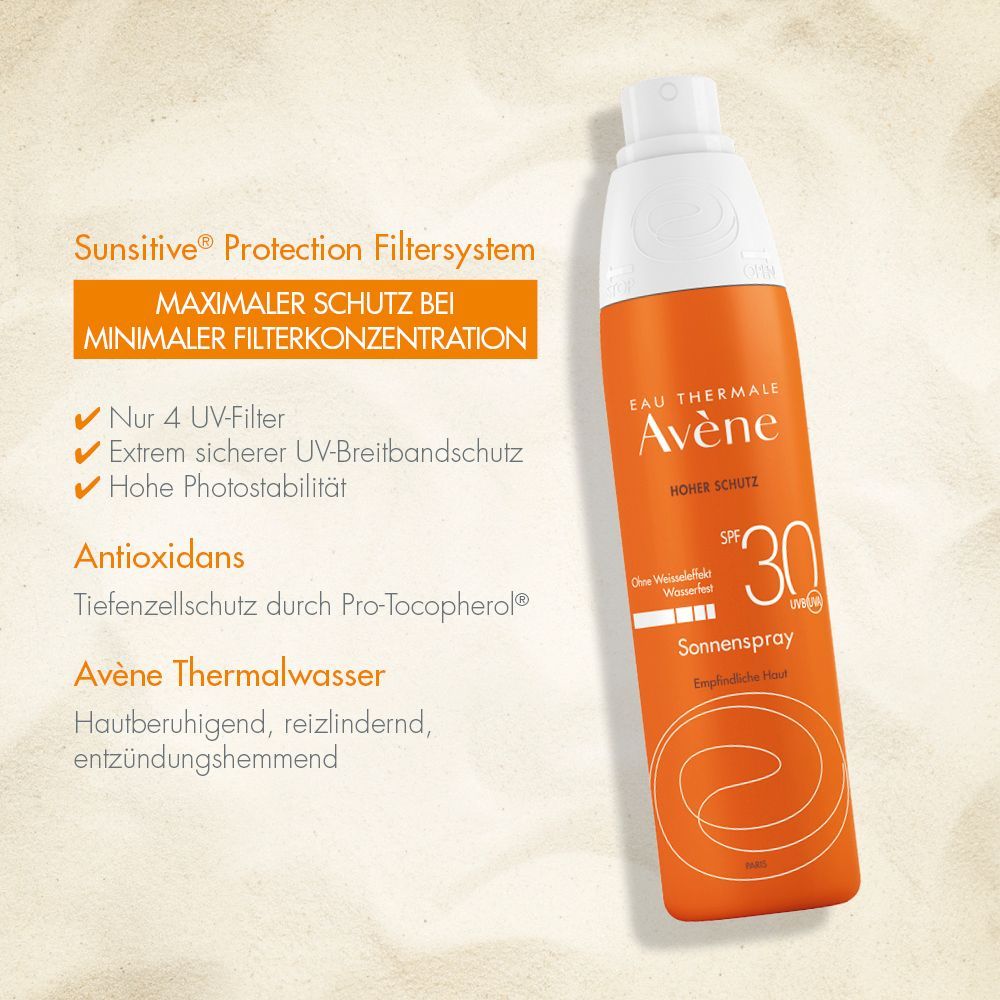 Flacon spray orange avec bouchon blanc. Inscription: Eau Thermale Avène, Sonnenspray SPF 30. Texte sur la protection UV et antioxydants.