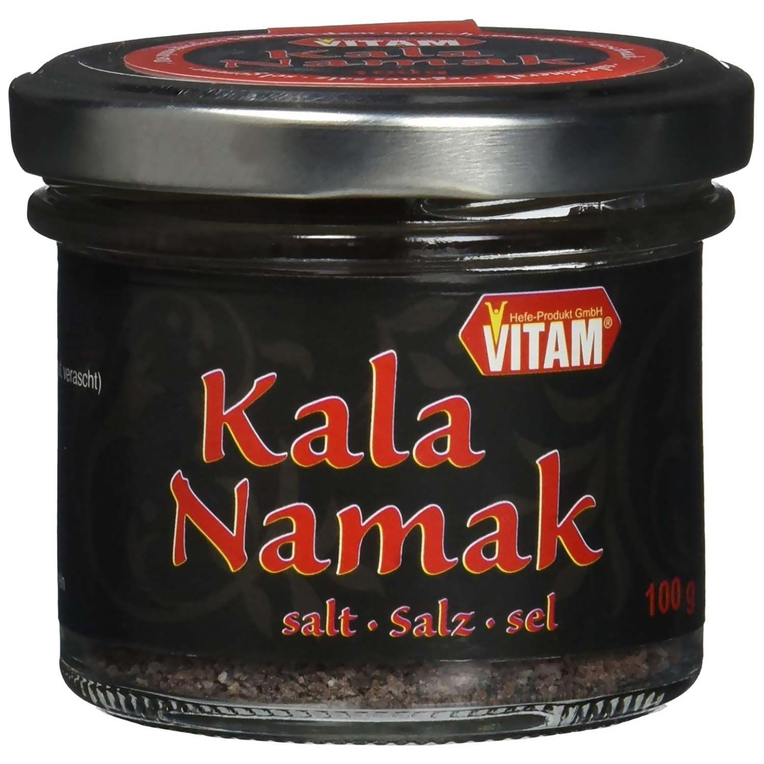 Pot de sel Kala Namak. Sel noir dans un pot en verre avec couvercle à vis. Inscription rouge : Kala Namak, logo Vitam.